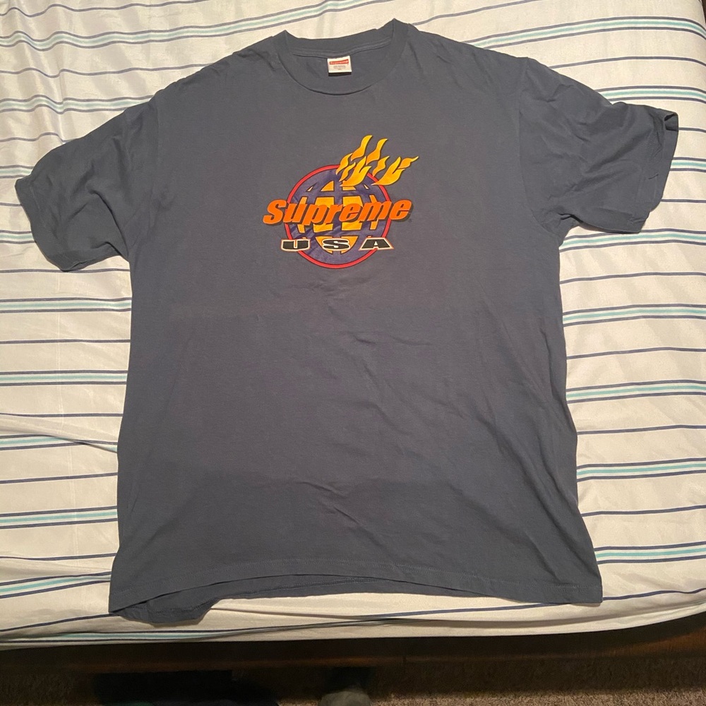 Blue tint Supreme shirt.